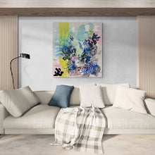 Load image into Gallery viewer, Burn original painting by Tania LaCaria displayed hanging in a living room with a beige sofa, white pillows and one blue accent pillows and a reeded wood accent wall.
