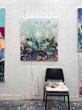 Load image into Gallery viewer, Dawn Chorus original painting by Tania LaCaria displayed hanging on a white wall in the artist&#39;s studio with an ikea chair and painted rag in the foreground..
