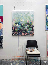 Load image into Gallery viewer, Dawn Chorus original painting by Tania LaCaria displayed hanging on a white wall in the artist's studio with an ikea chair and painted rag in the foreground..