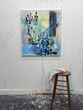 Load image into Gallery viewer, Homecoming by Tania LaCaria original painting hanging on a white wall in the artist&#39;s studio with a wooden stool in the foreground
