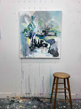 Load image into Gallery viewer, Unclear original painting by Tania LaCaria shown hanging on a white wall with a wood stool in the foreground in the artist&#39;s studio.
