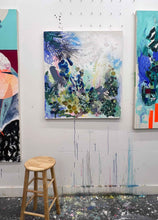 Load image into Gallery viewer, Whisper original painting by Tania LaCaria displayed hanging on a white wall between two other paintings that can't be seen in the artist's studio with a wood stool in the foreground.